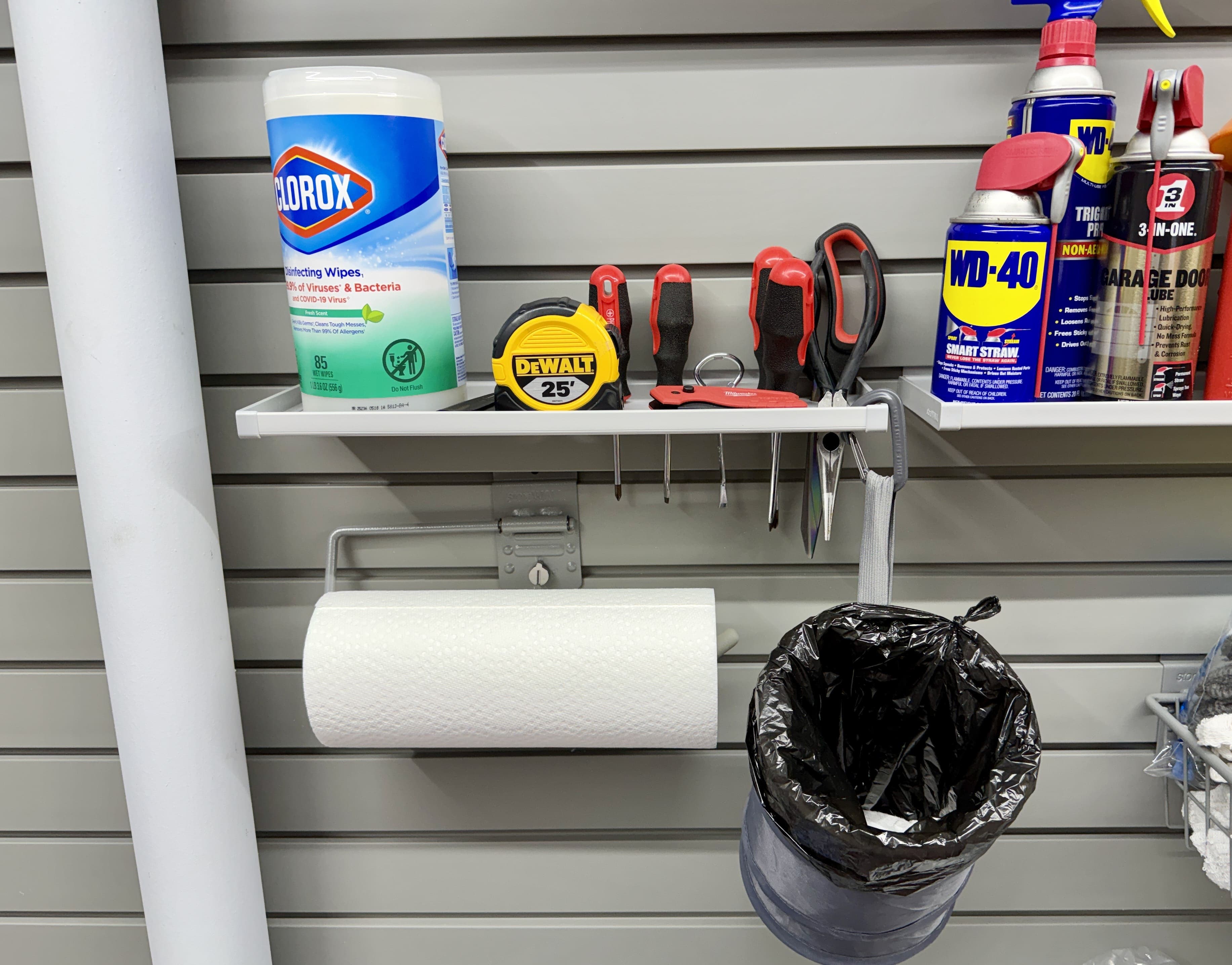 Shelves and brackets installed for miscellaneous items including a paper towel rack