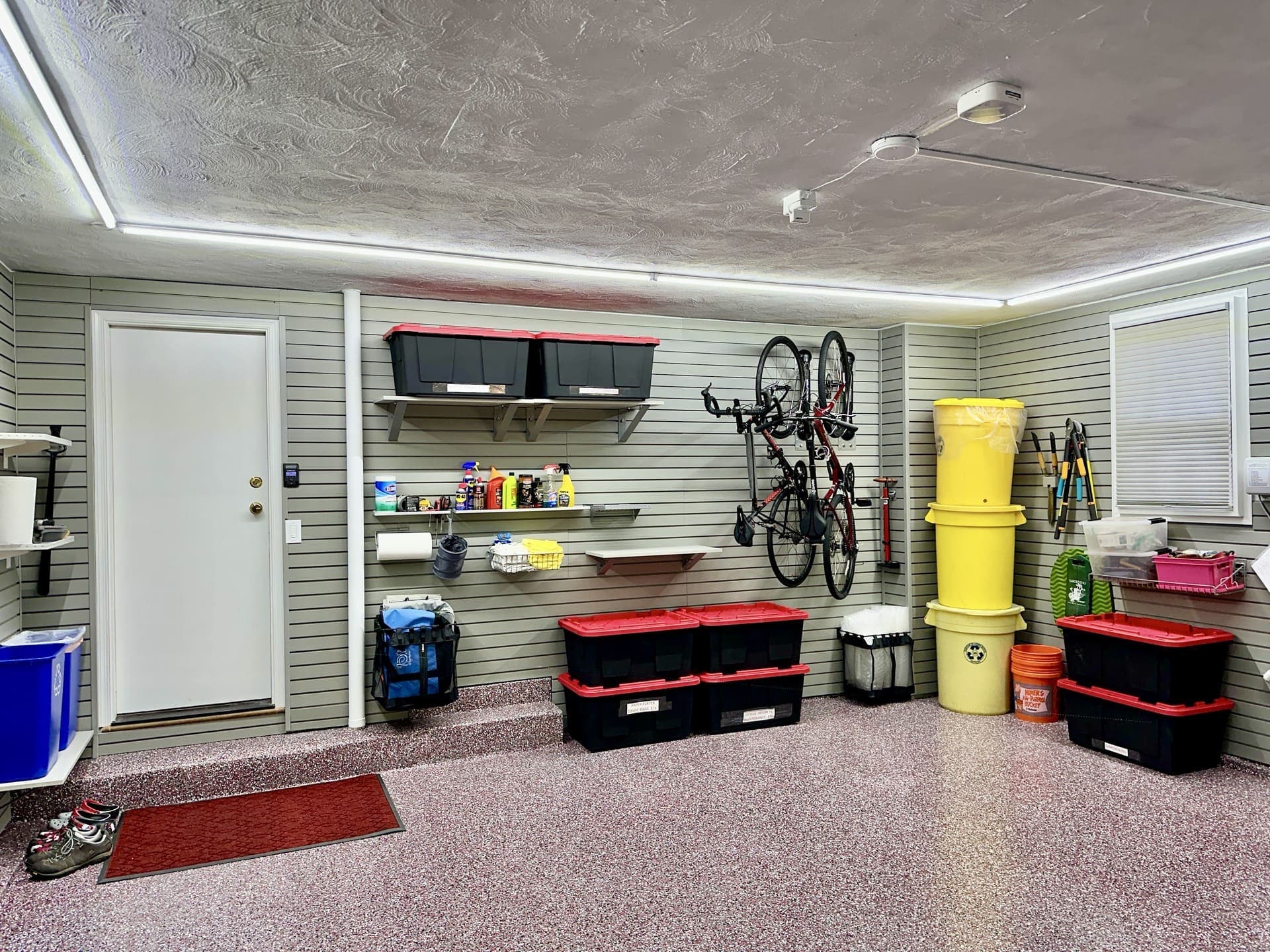 Back wall organized with bike racks and shelves for everything