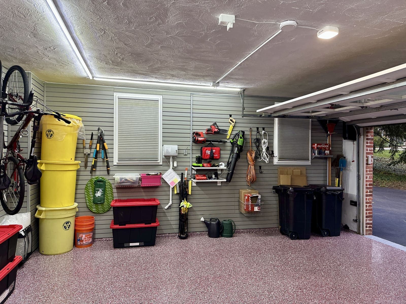 Shelves and baskets installed for tools, with battery powered tools plugged in